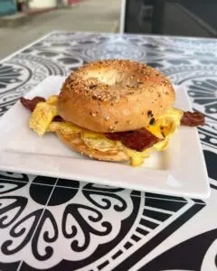 Everything bagel breakfast sandwich with egg and bacon
