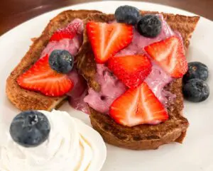 French toast with strawberry and blueberry topping