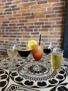 Cocktails, wine, and beer on patterned table