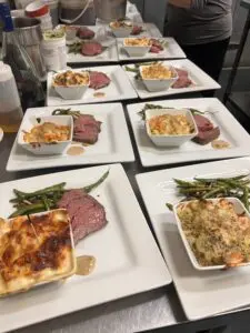 Plated roast beef with gratin and green beans